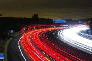 High speed photo of busy highway at night