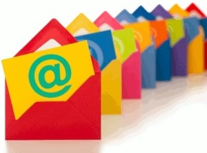 Brightly colored envelopes and cards with large email "AT" sign
