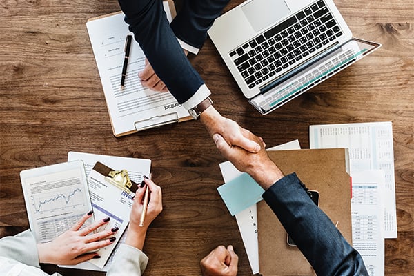Real estate agent communicating with a client by phone