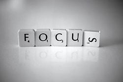 Scrabble pieces spelling out the word focus